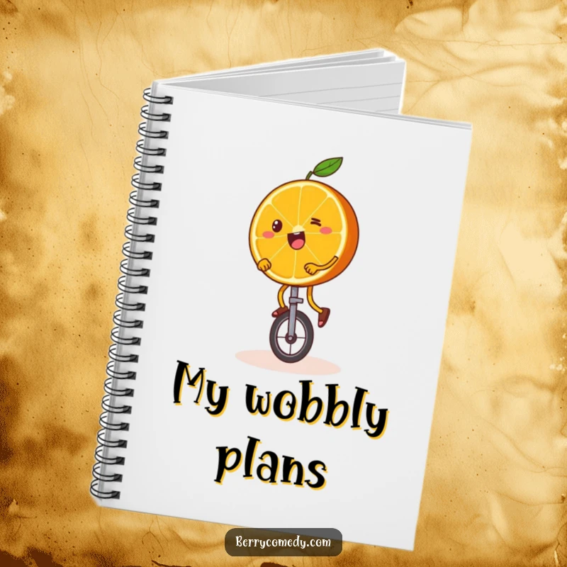 Funny notebook with a happy orange slice, wobbly legs and all, attempting to ride a unicycle, perfect for notes and ambitious plans.